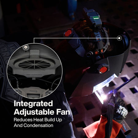 A technical marketing infographic of the Phoenix Series welding helmet. Callouts highlight the integrated cooling fan for airflow, the large center auto-darkening filter with True Color technology, peripheral fixed-shade side windows, and large external control buttons for easy operation with gloves.