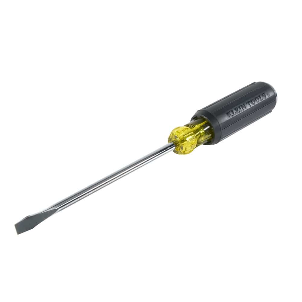 An angled studio view of the Klein Tools 602-7DD keystone demolition screwdriver showcasing the flat 5/16 inch slotted tip, high-visibility yellow bolster, and ergonomic black handle with embossed brand lettering.