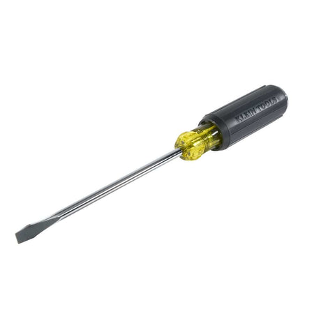 An angled studio view of the Klein Tools 602-7DD keystone demolition screwdriver showcasing the flat 5/16 inch slotted tip, high-visibility yellow bolster, and ergonomic black handle with embossed brand lettering.