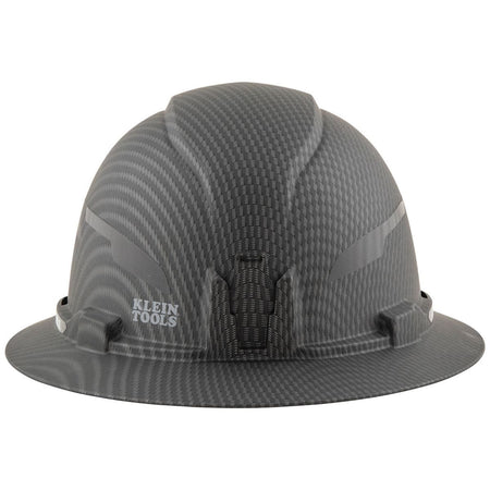 A front profile of the safety helmet highlighting the high-quality KARBN™ hydro-dipped finish and the grey Klein Tools logo, designed for professionals requiring Type 1 Class E electrical protection tested up to 20kV.