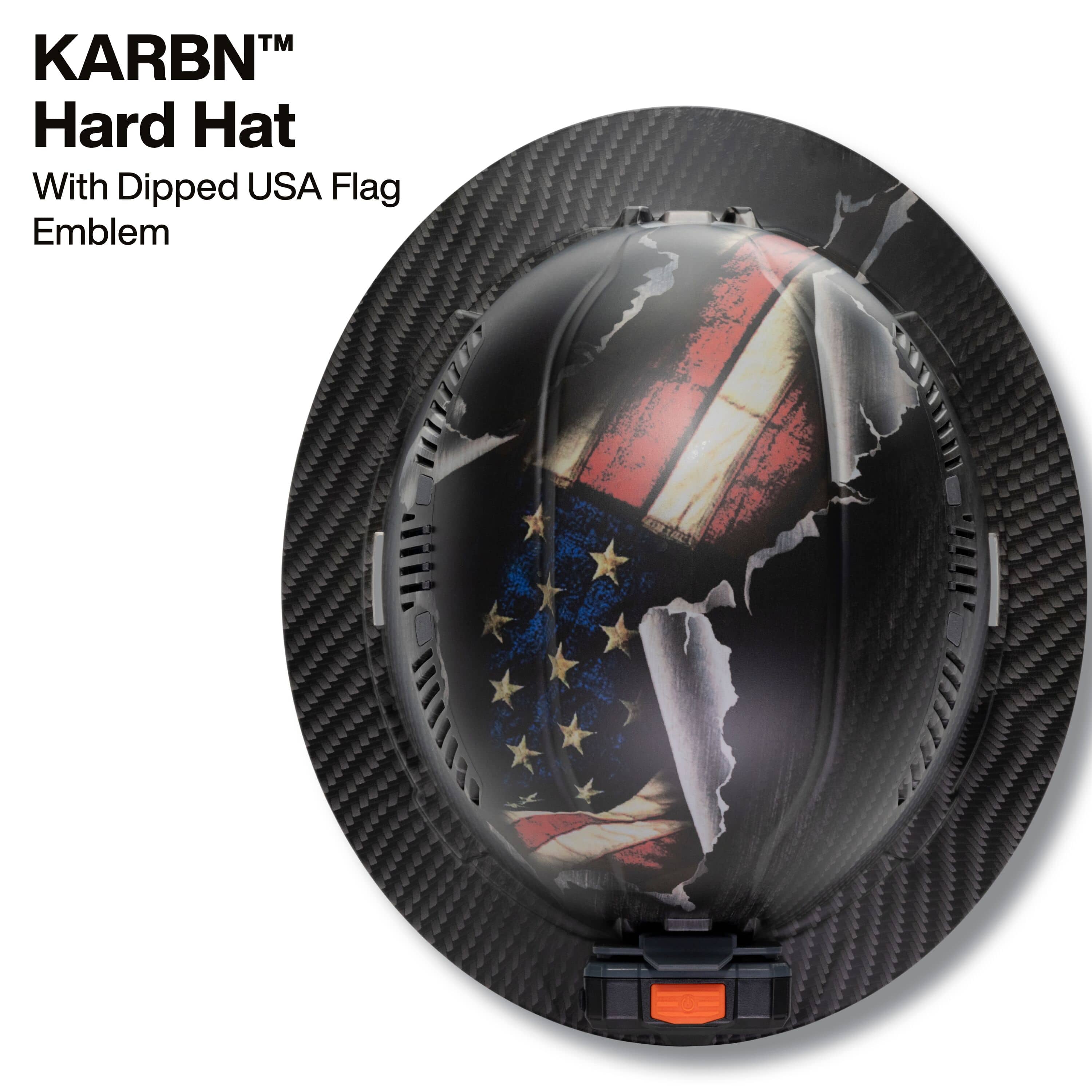 Top-down view of the Klein Tools Freedom Series hard hat showcasing the durable PC ABS shell with a torn American flag emblem over a carbon fiber pattern.