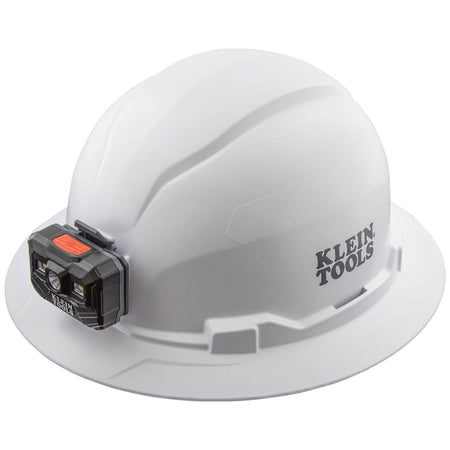 A perspective view of the Klein Tools 60406RL white full brim hard hat featuring an integrated, front-mounted rechargeable LED headlamp for hands-free professional safety and construction illumination.
