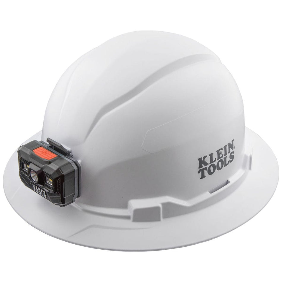 A perspective view of the Klein Tools 60406RL white full brim hard hat featuring an integrated, front-mounted rechargeable LED headlamp for hands-free professional safety and construction illumination.