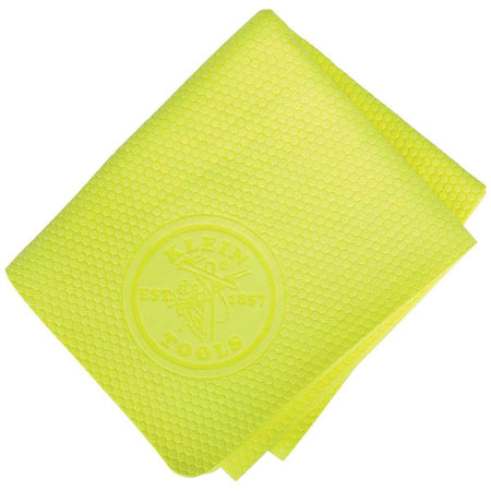 A direct overhead view of a folded high-visibility yellow Klein Tools cooling wrap, highlighting its unique micro-textured polygon pattern structure and a centered, embossed circular brand heritage logo.