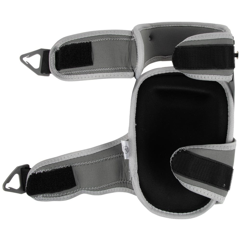 The interior view of a Klein Tools 60897 knee pad laid flat, showing the thick black gel and foam padded pocket designed for all-day pressure distribution and comfort, along with the adjustable gray and black neoprene straps.