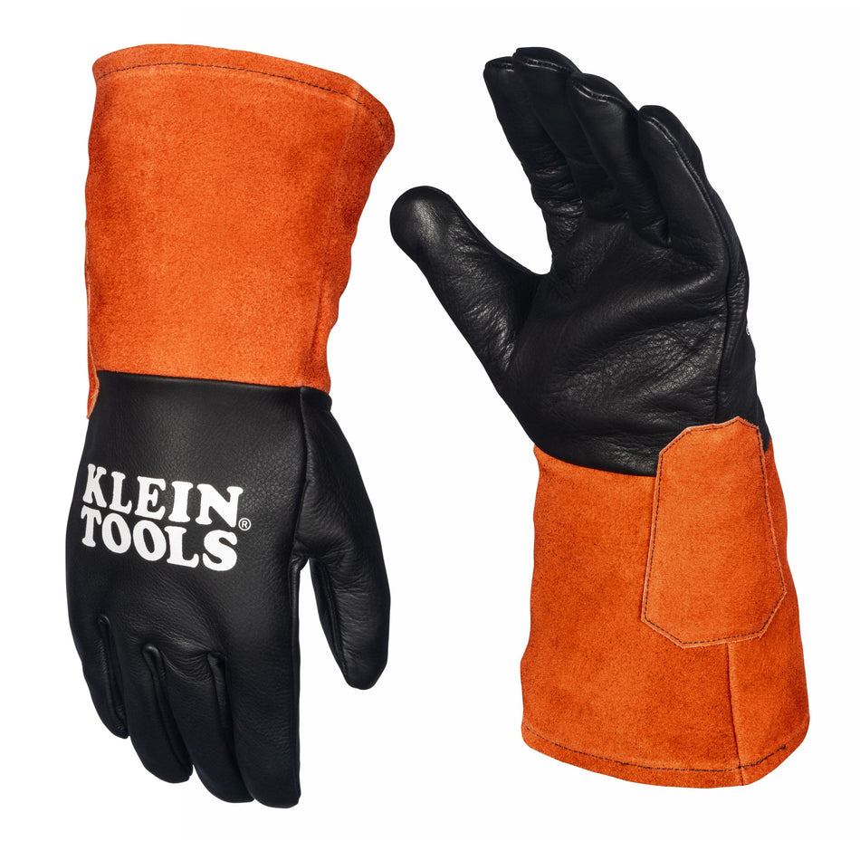 A studio product view of the Klein Tools 60913 TIG welding gloves. The image displays a pair of extra-large professional gloves with black full-grain cowhide leather on the hands for dexterity and long, bright orange split cowhide cuffs for superior spark and spatter protection.
