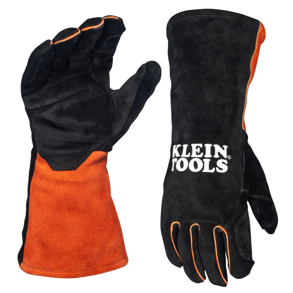 A studio product view of the Klein Tools 60914 MIG welding gloves. The image shows the palm and back views of the professional gloves, featuring durable black split cowhide leather hands with reinforced padding and long orange safety cuffs for heavy spark and spatter protection.