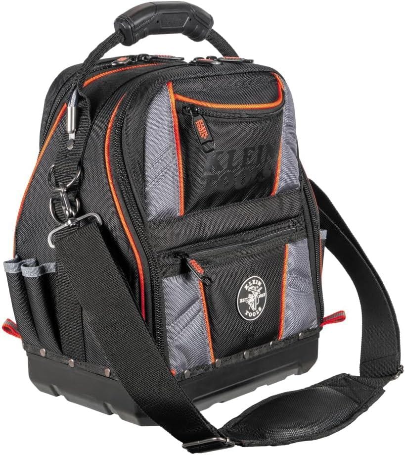 Studio view of the black and gray Klein Tools Tool Runner bag with orange trim, featuring a padded shoulder strap and rugged carrying handle.