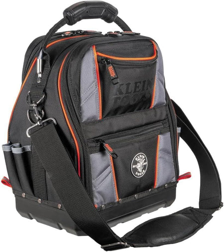 Studio view of the black and gray Klein Tools Tool Runner bag with orange trim, featuring a padded shoulder strap and rugged carrying handle.