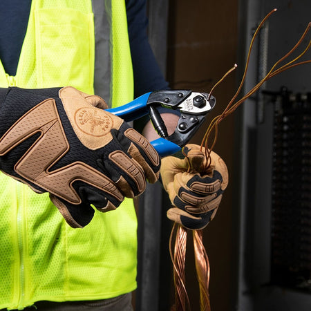 A professional view of a worker utilizing the one-handed operation of the 63016 to shear individual copper strands, showcasing its efficiency for high-repetition electrical infrastructure tasks.
