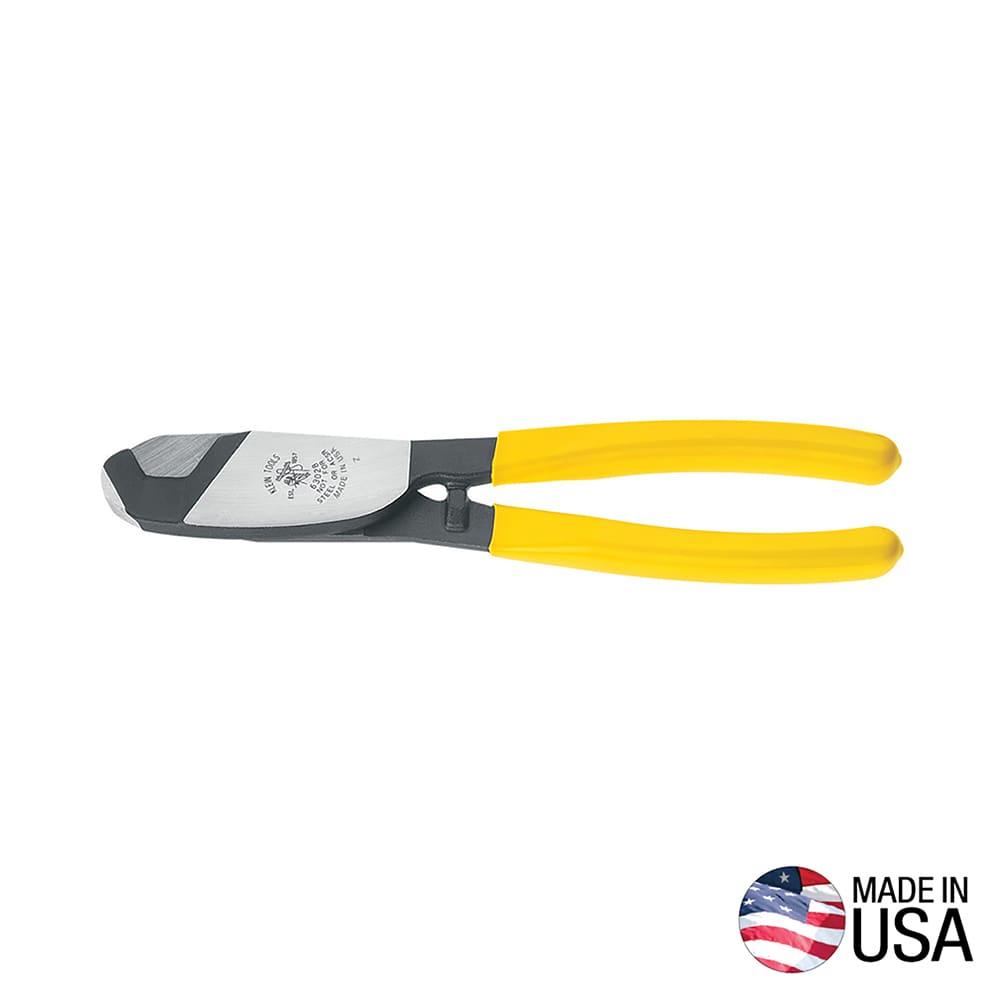 A professional side profile of the Klein Tools 63028 coaxial cable cutter, featuring induction-hardened forged steel jaws and ergonomic yellow plastic-dipped handles designed for one-handed shear cutting, with a Made in USA logo.