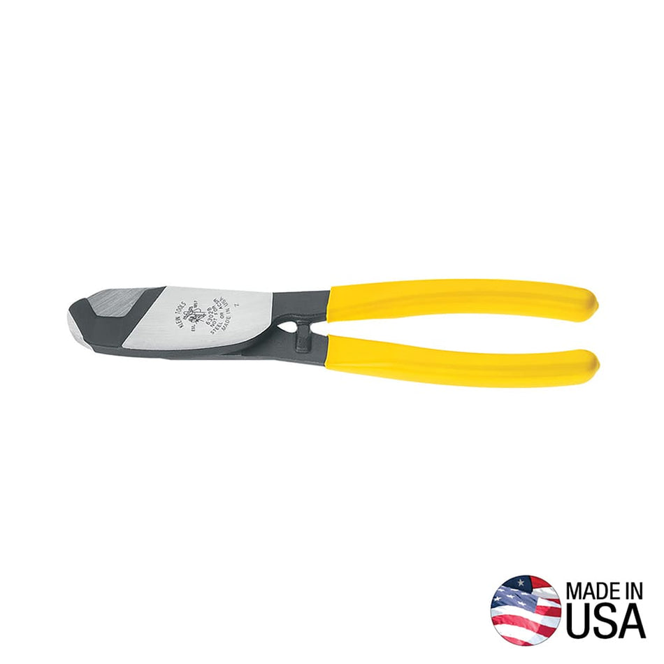 A professional side profile of the Klein Tools 63028 coaxial cable cutter, featuring induction-hardened forged steel jaws and ergonomic yellow plastic-dipped handles designed for one-handed shear cutting, with a Made in USA logo.