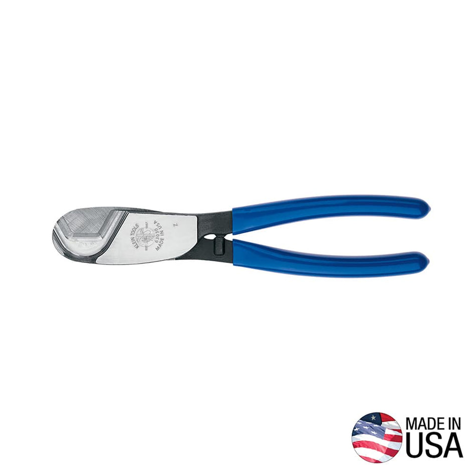 A professional side profile of the Klein Tools 63030 coaxial cable cutter, featuring precision-ground forged steel jaws and ergonomic blue plastic-dipped handles designed for one-handed shear cutting, with a Made in USA logo.