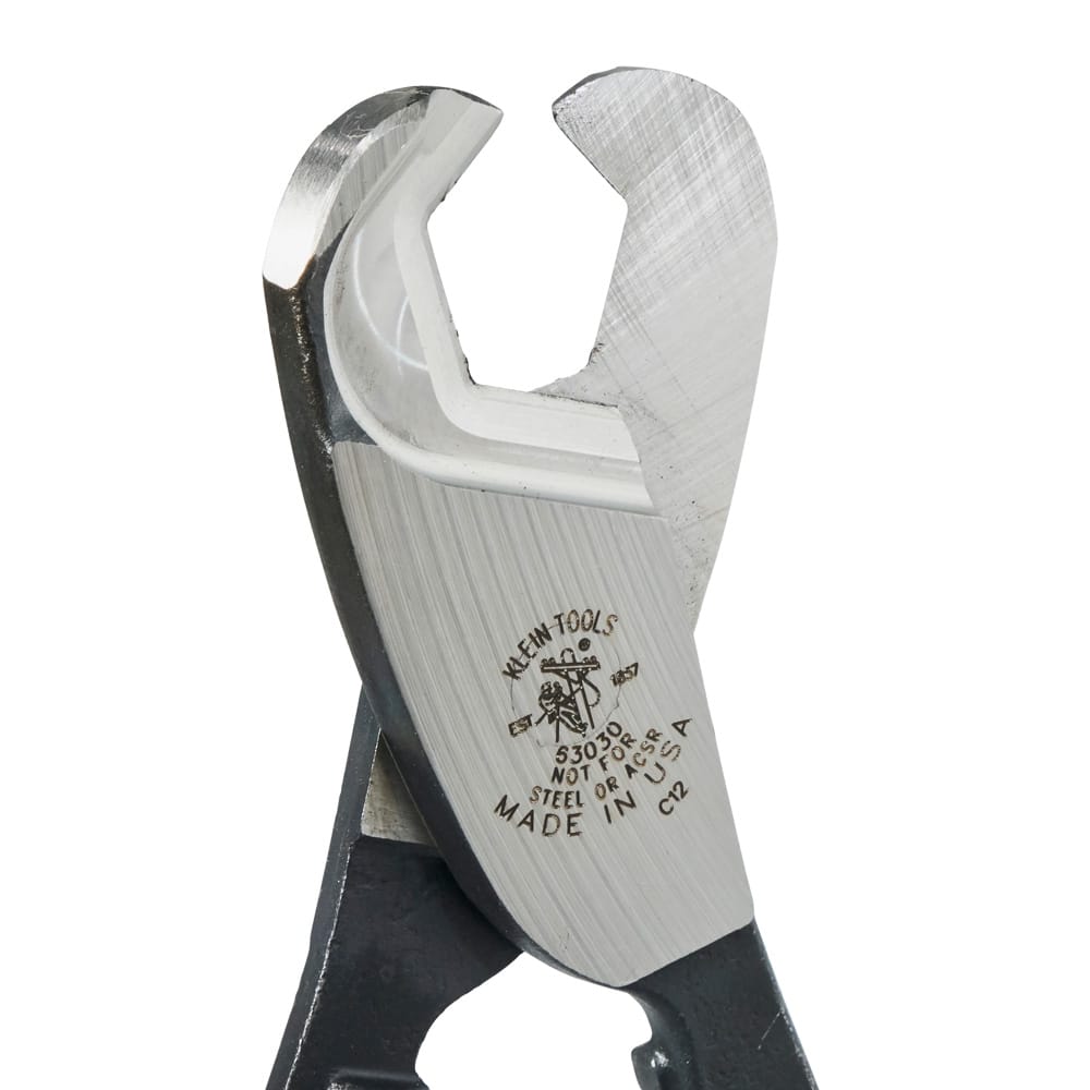 A detailed macro shot of the precision-ground shear blades on the 63030 cutter, illustrating the specialized jaw geometry engineered to grab and cleanly slice through large-diameter communication cables.