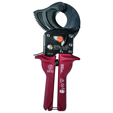 A professional side profile of the Klein Tools 63601 compact ratcheting cable cutter, featuring high-leverage gearing, ergonomic red handles with hand guards, and induction-hardened forged steel jaws designed for one-handed operation.