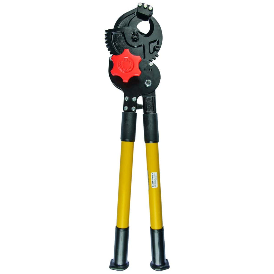 A full-length professional profile of the Klein Tools 63700 heavy-duty ratcheting cutter, featuring long yellow steel handles with black vinyl grips and a massive black-oxide coated ratcheting head with a red blade-advance knob.