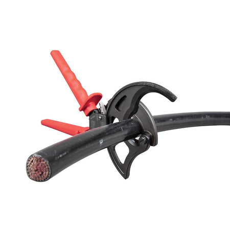 An application photo showing the specialized jaw geometry of the 63750 ratcheting cutter as it engages a thick black insulated cable, providing a clean, burr-free shear cut without distorting the conductor.