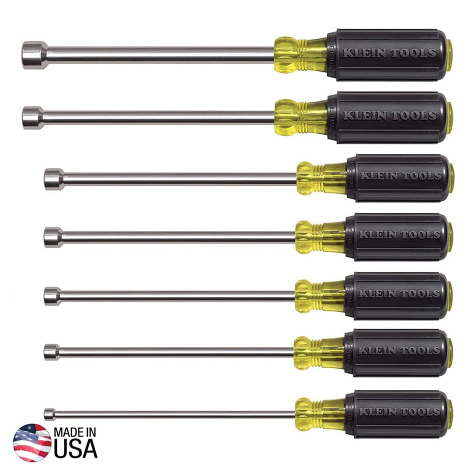 A studio product shot of the Klein Tools 647M 7-piece magnetic nut driver set featuring seven SAE drivers with 6-inch hollow shafts and black Cushion-Grip handles, accompanied by a Made in USA emblem.