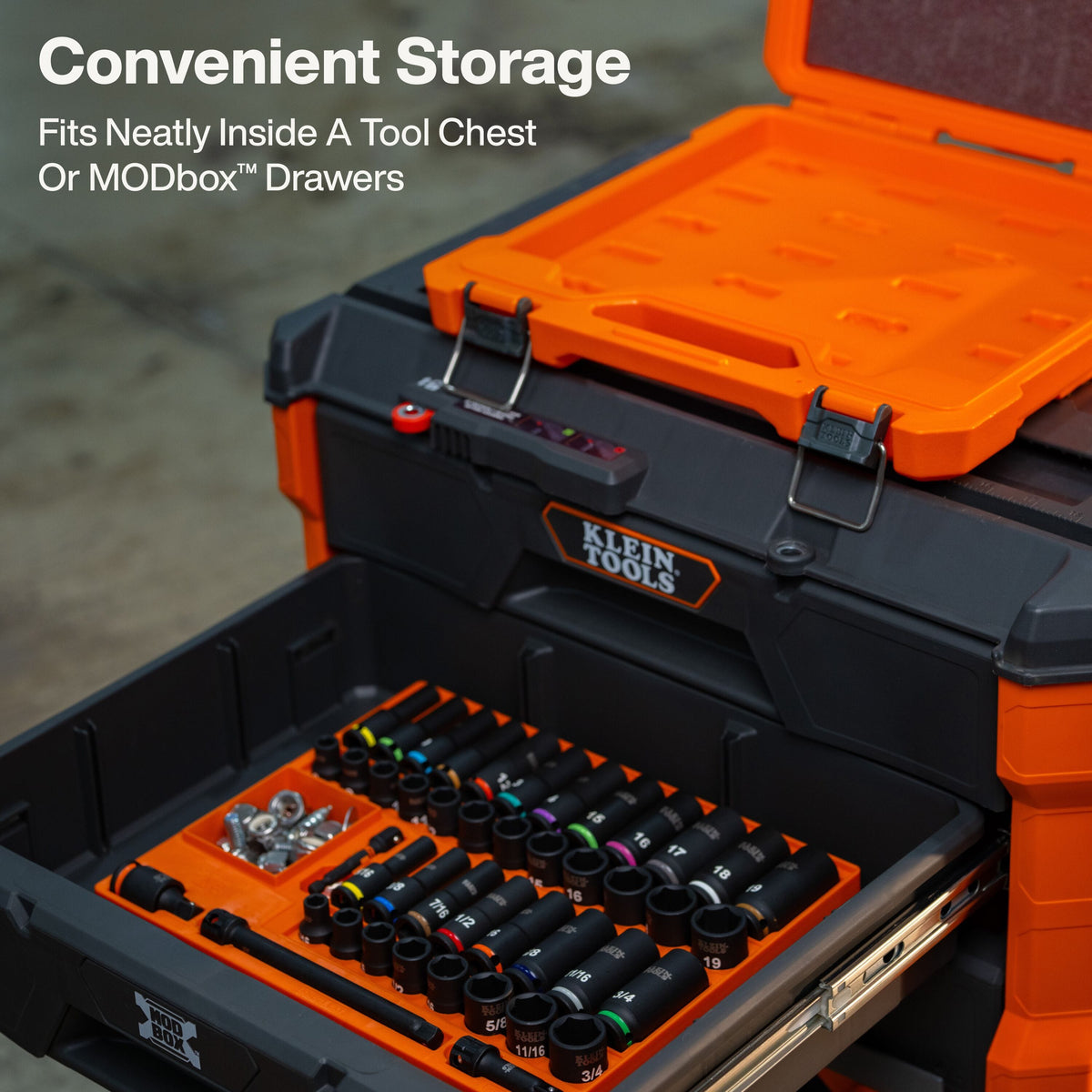 An image showing the modularity of the set, with the removable socket organizer tray nested neatly inside a black MODbox tool chest drawer for efficient workshop and job site organization.
