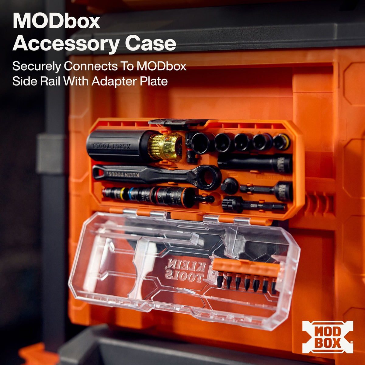 The KNECT starter set MODbox accessory case shown securely mounted to the side rail of a larger orange Klein Tools rolling tool box using a specialized adapter plate for efficient vertical tool organization on the job site.