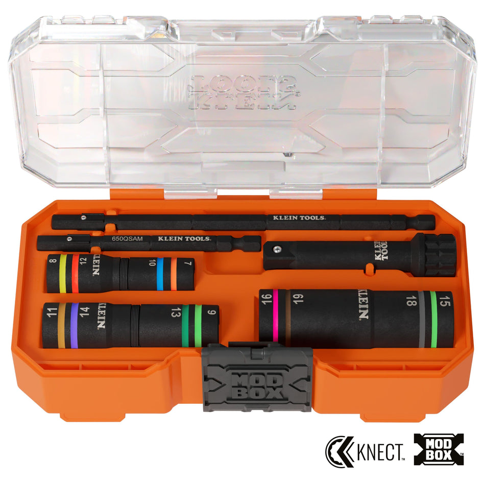 A studio shot of the Klein Tools 653MQS KNECT metric impact flip socket set organized inside an orange MODbox accessory case with a clear lid, featuring three color-coded quad sockets, two extension shafts, and a drive adapter.