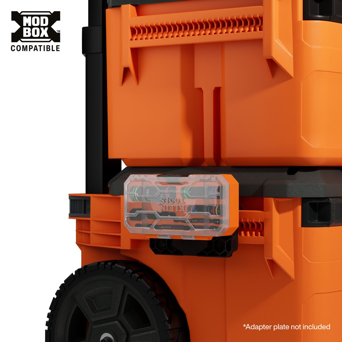 The 653MQS quad socket set case mounted to the side of a larger MODbox rolling tool tower, demonstrating the modular compatibility and accessibility of the system on a busy job site.