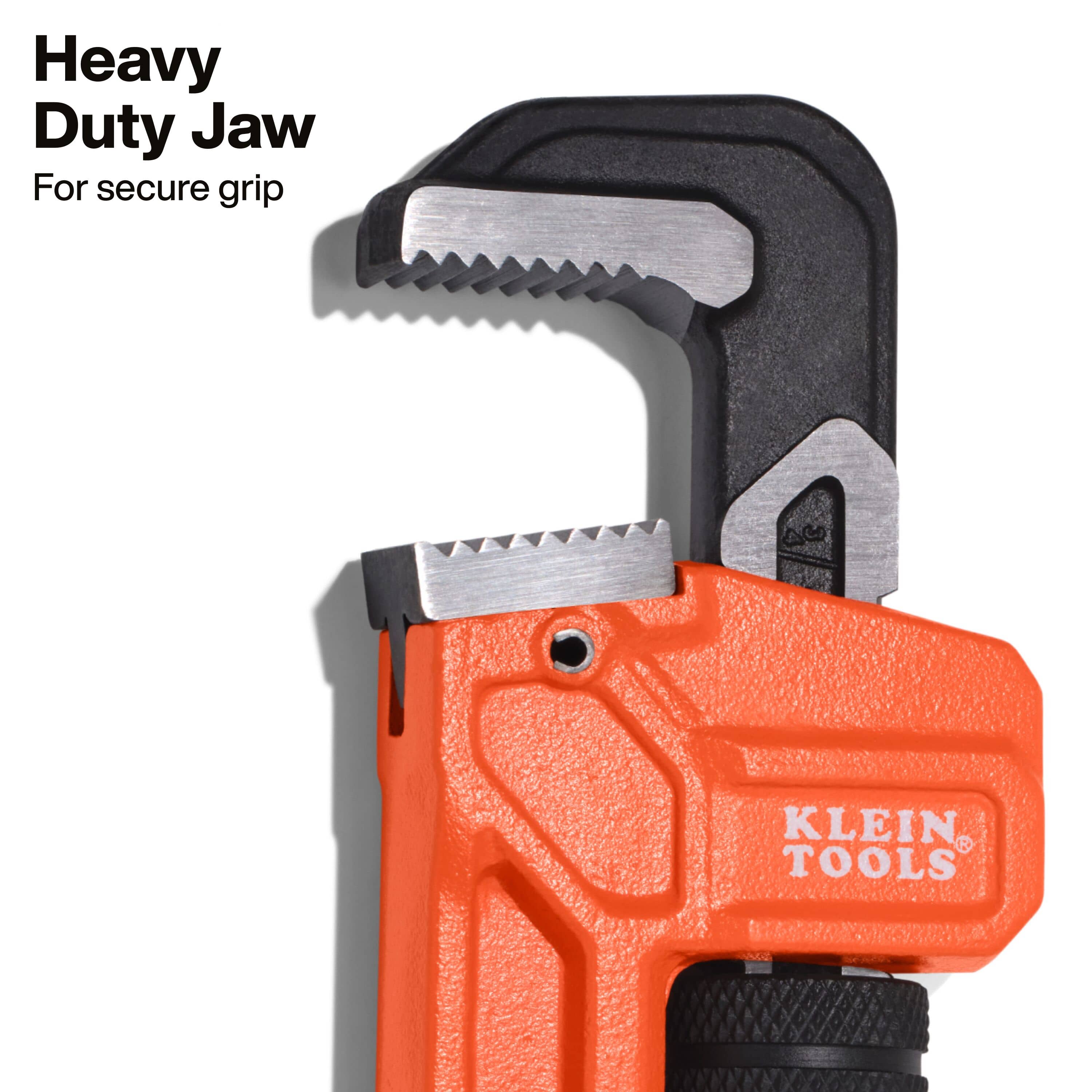 Macro detail of the heavy-duty jaw teeth on the Klein Tools pipe wrench, highlighting the optimized tooth design engineered for a secure, no-slip grip on steel and iron pipes.