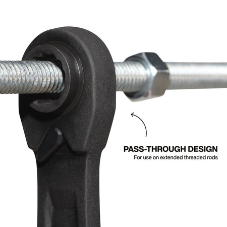 A functional demonstration of the pass-through wrench head design, showing the hollow ratcheting socket in use on a long threaded rod to facilitate driving hex nuts without the depth limitations of standard sockets.