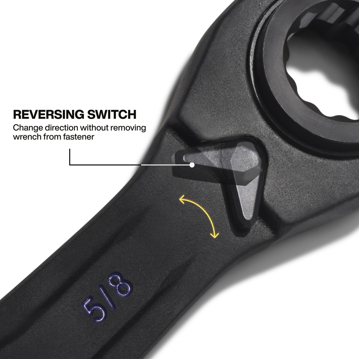 A detailed view of the integrated reversing switch located on the wrench head, allowing the user to change ratcheting direction instantly without removing the tool from the fastener.
