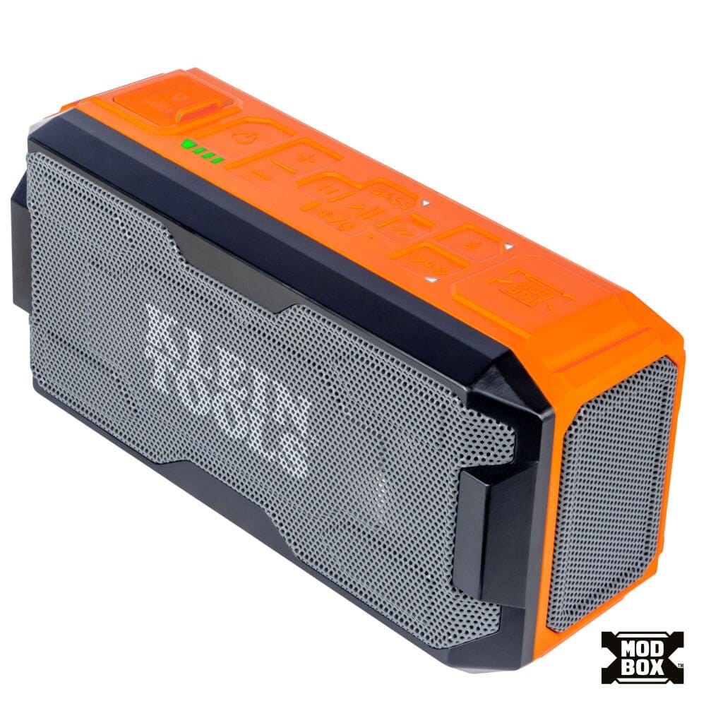 Angled studio view of the Klein Tools MODbox Bluetooth Speaker featuring a rugged orange and black housing with a grey mesh front grille.