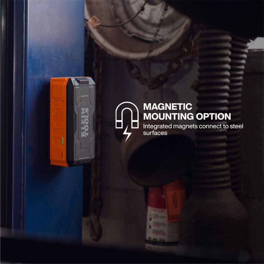 Lifestyle view of the speaker magnetically mounted vertically to a steel beam, demonstrating the integrated magnets for hands-free placement.