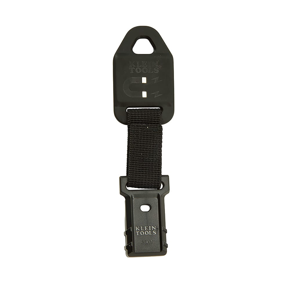 A studio product view of the Klein Tools 69417 magnetic hanger featuring a powerful rare-earth magnet plate, a durable black nylon weave strap, and a specialized clip designed for multimeter attachment. The heavy-duty construction is built for professional hands-free diagnostic work.