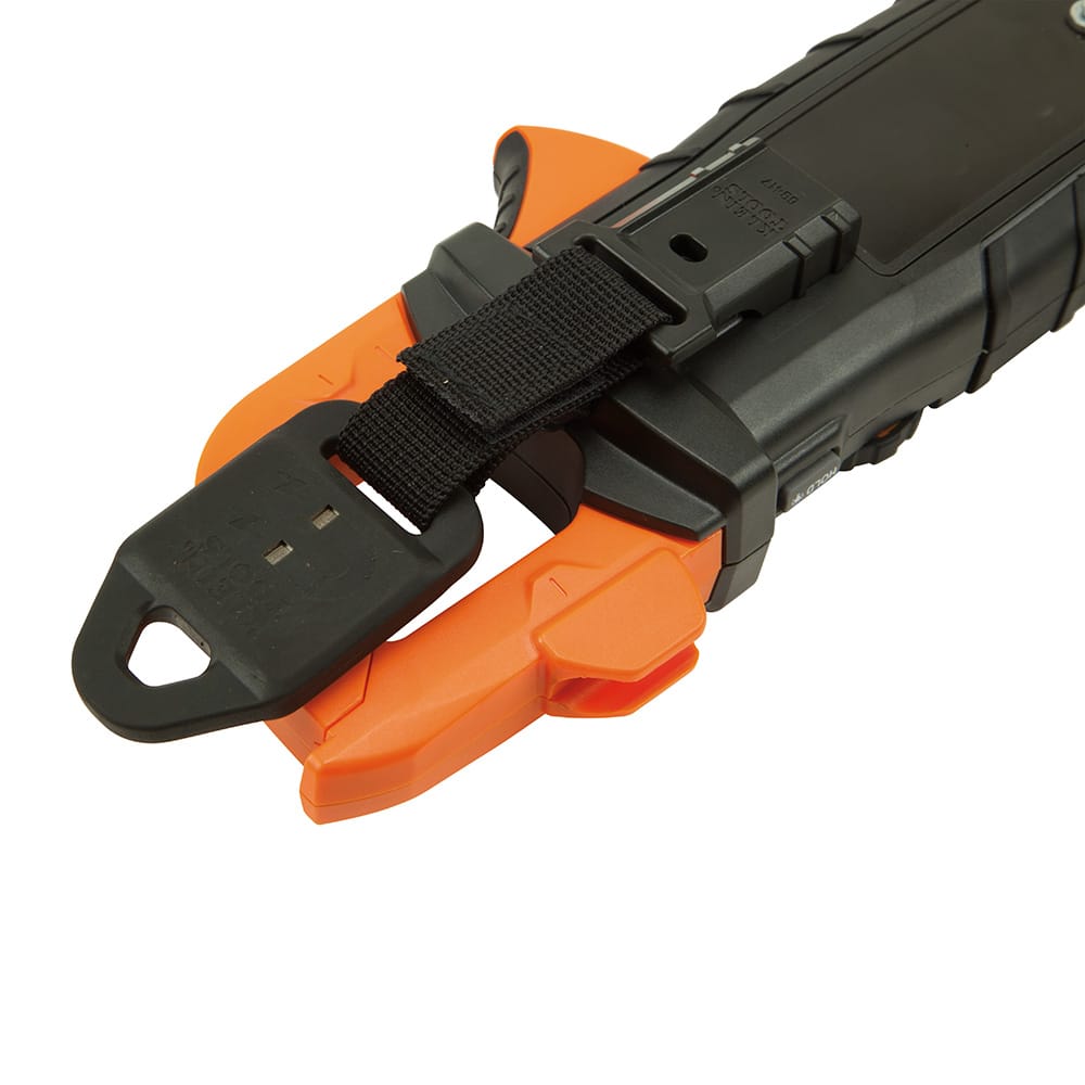 Close-up view of the magnetic hanger attached to a Klein Tools CL series digital clamp meter. The image emphasizes the secure fit of the snap-in clip and the strength of the nylon strap, designed to keep professional testers safely suspended during hands-free electrical inspections.