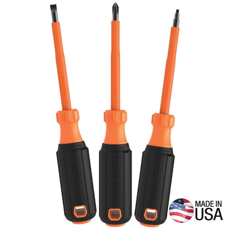 Klein Tools 85073INS 3-piece heavy-duty insulated screwdriver set arranged vertically in a fan layout, displaying three commercial electrician drivers with black cushion-grip handles, orange transition collars, and bright orange flame-resistant insulated shanks, featuring a Made in USA emblem on the lower right corner isolated on a white background.