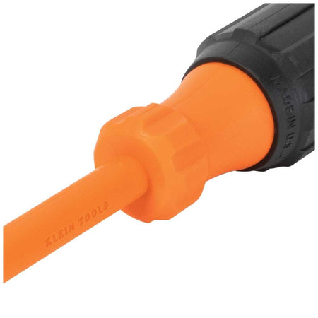 Klein Tools industrial-grade insulated hand screwdriver shaft transition zone detail view, illustrating the seamless injection-molded union between the smooth bright orange protective dielectric layer and a fluted orange high-dielectric handle bolster component clearly stamped with a Made in USA quality marking.