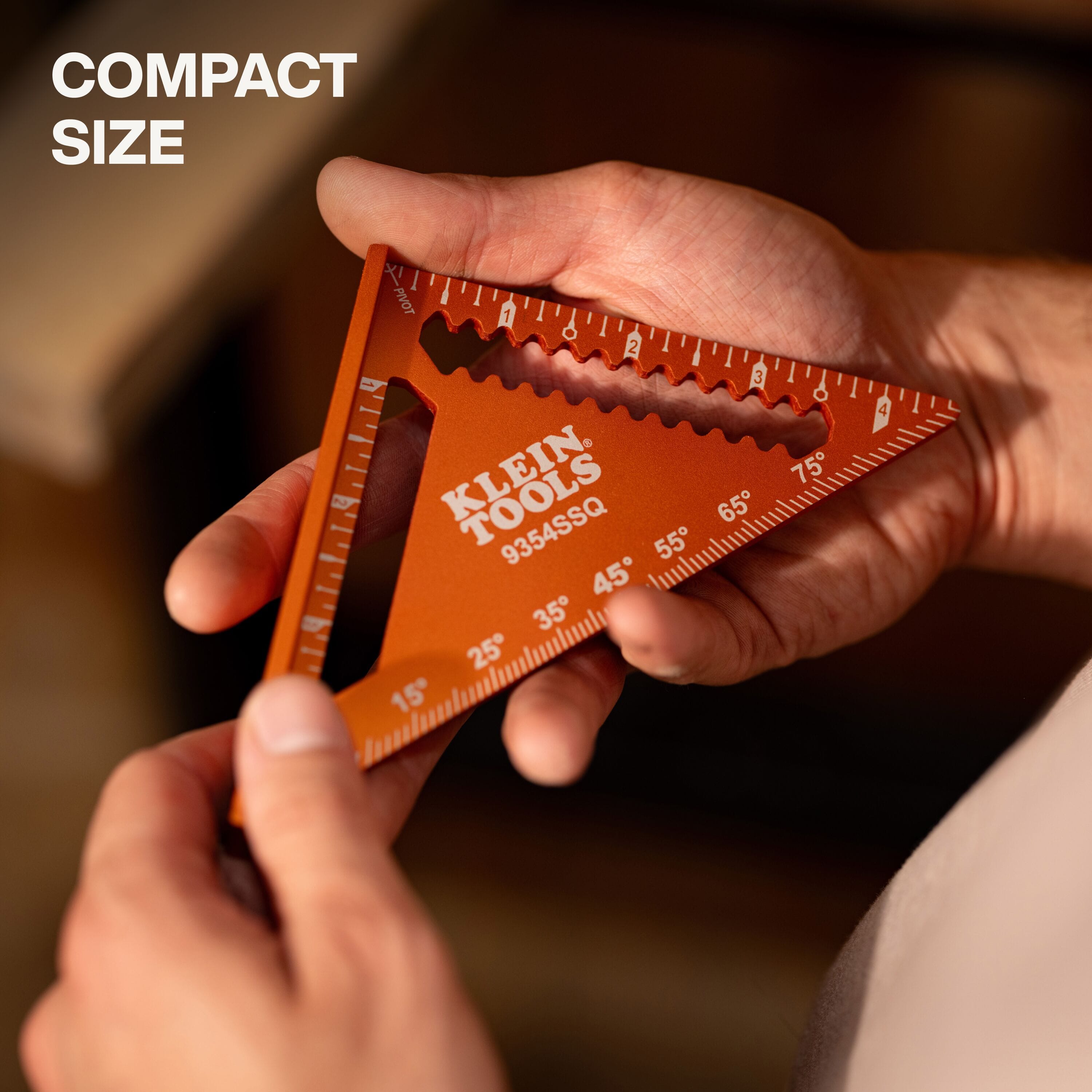 A hand holding the compact aluminum rafter square to illustrate its portable size, emphasizing its lightweight design that fits easily into tool pouches or pockets for on-the-go carpentry tasks.