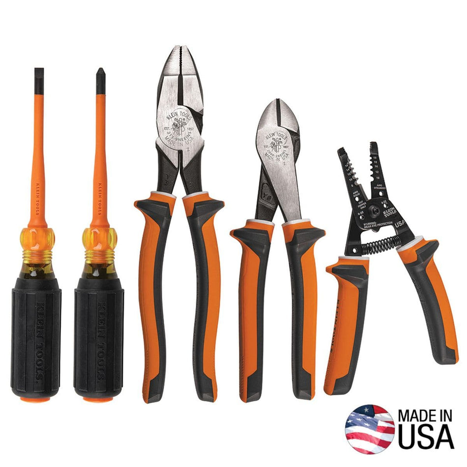 A complete product display of the Klein Tools 94130 insulated tool kit containing a cabinet tip screwdriver, a Phillips screwdriver, linesman side-cutting pliers, diagonal cutters, and a wire stripper, all featuring orange and black high-dielectric handles alongside a circular Made in USA logo.