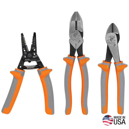 Klein Tools 9416R 1000V insulated 3-piece shock protection set showing a dual-purpose wire stripper cutter next to a pair of side-cutting linemen pliers and high-leverage diagonal-cutting pliers, all featuring bright orange and gray molded handles with defensive thumb guards, showcased with a circular Made in USA badge on a clean white background.