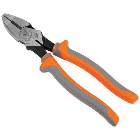 Klein Tools 2139NERINS high leverage insulated side cutting linesman pliers shown from an angled side perspective, featuring a rugged carbon steel jaw assembly, black oxide structural joints, and non slip gray and orange dielectric protection handles layout isolated on a white background.