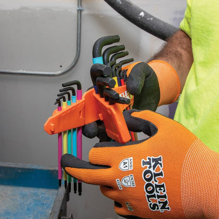 Technician demonstrating the interlocking feature of the Klein Tools SAE and metric hex key caddies, which allows for organized and sleek tool storage.