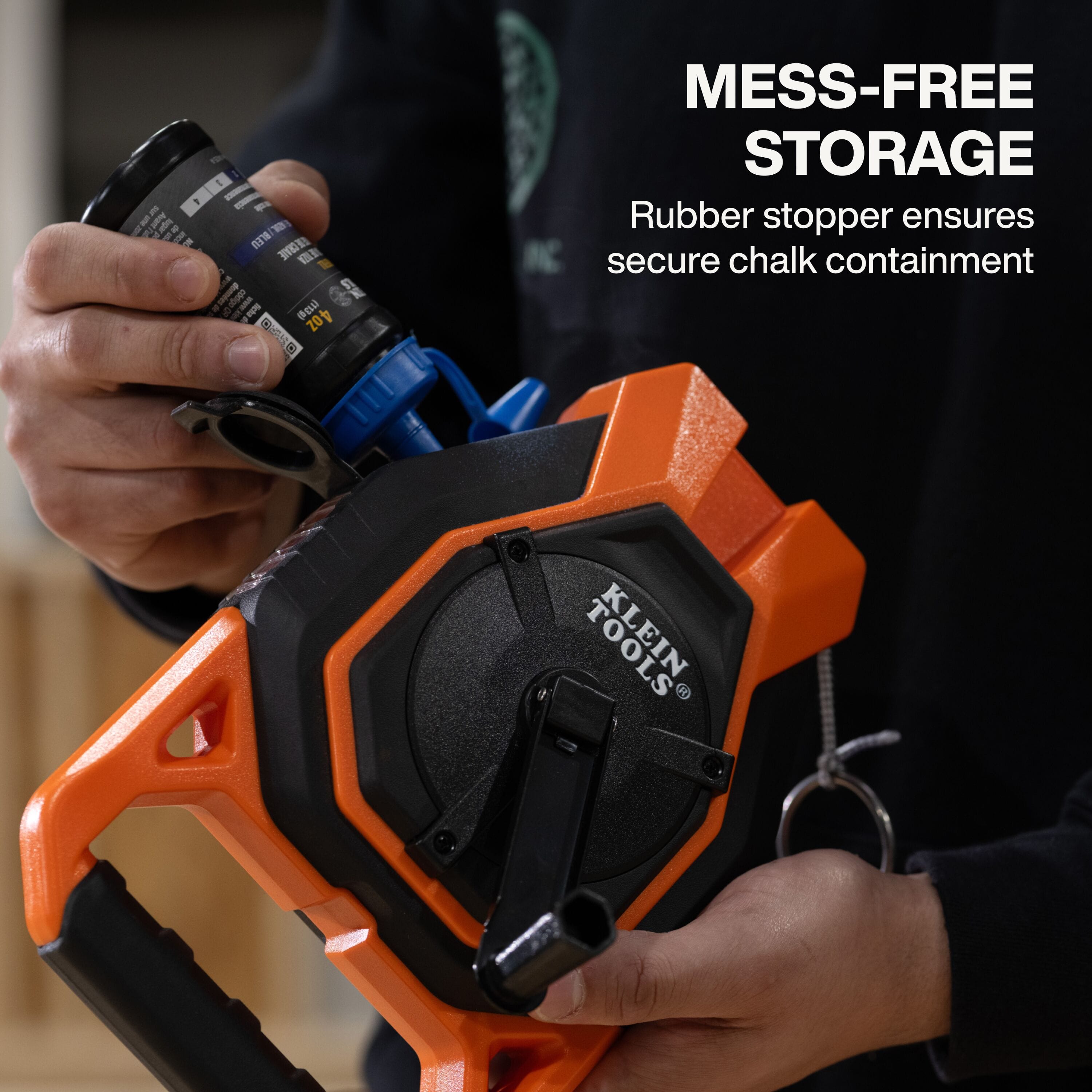 A functional demonstration of the mess-free storage system showing a blue chalk bottle refilling the reel through the secure rubber stopper opening designed for clean and efficient jobsite refills.