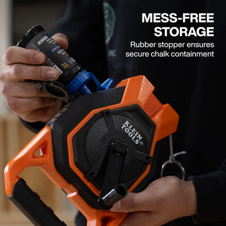A functional demonstration of the mess-free storage system showing a blue chalk bottle refilling the reel through the secure rubber stopper opening designed for clean and efficient jobsite refills.