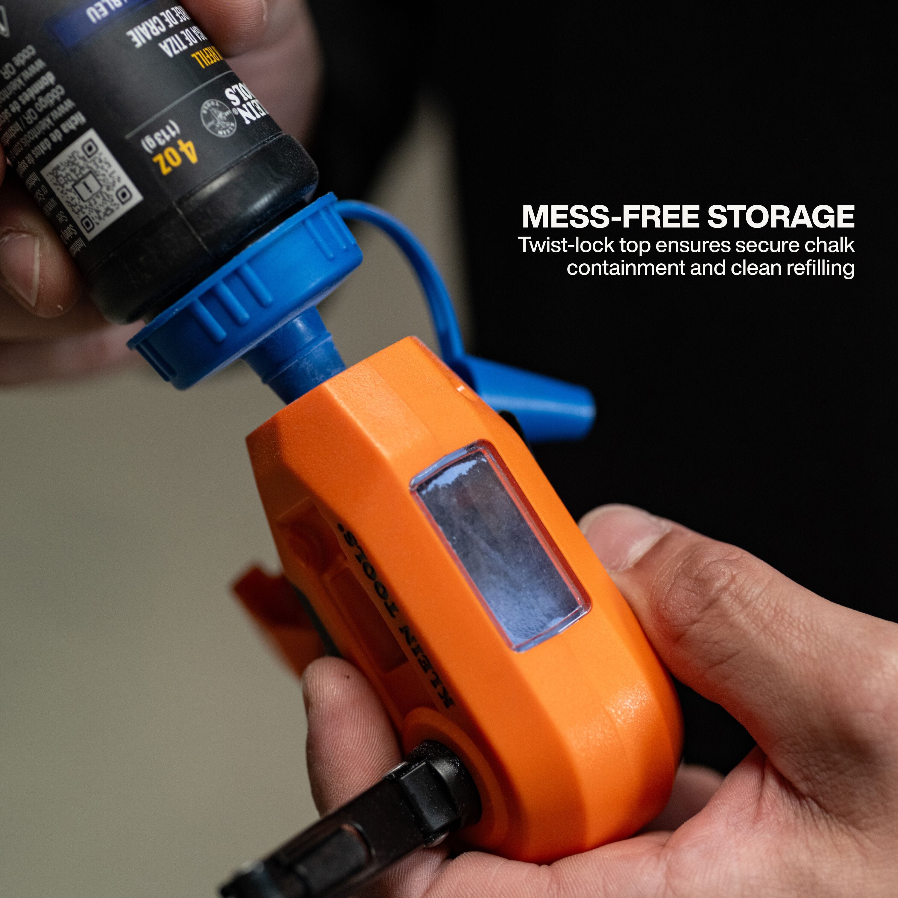An in-use demonstration showing a professional tradesperson refilling the chalk reel through its secure twist-lock top, illustrating the mess-free storage design and clean refilling process.