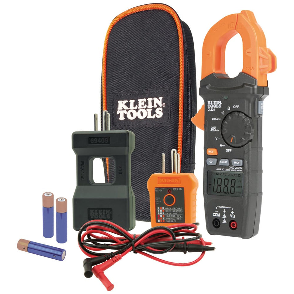 A studio kit shot of the Klein Tools CL120KIT electrical testing system. The professional diagnostic set includes the CL120 400A AC auto-ranging digital clamp meter with test leads, the 69409 10x line splitter, the RT210 GFCI receptacle tester, three AAA batteries, and a heavy-duty black and orange zippered storage pouch.