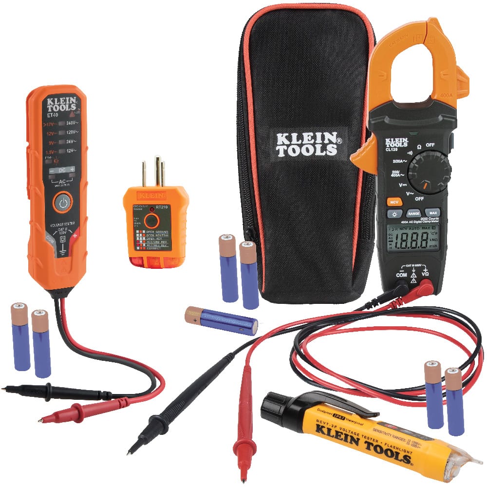 The complete Klein Tools CL120VP Electrical Test Kit displayed with its essential components: the CL120 digital clamp meter, ET40 electronic voltage tester, RT210 GFCI receptacle tester, NCVT-3P dual-range non-contact voltage tester with flashlight, a padded carrying case, and seven AAA batteries.