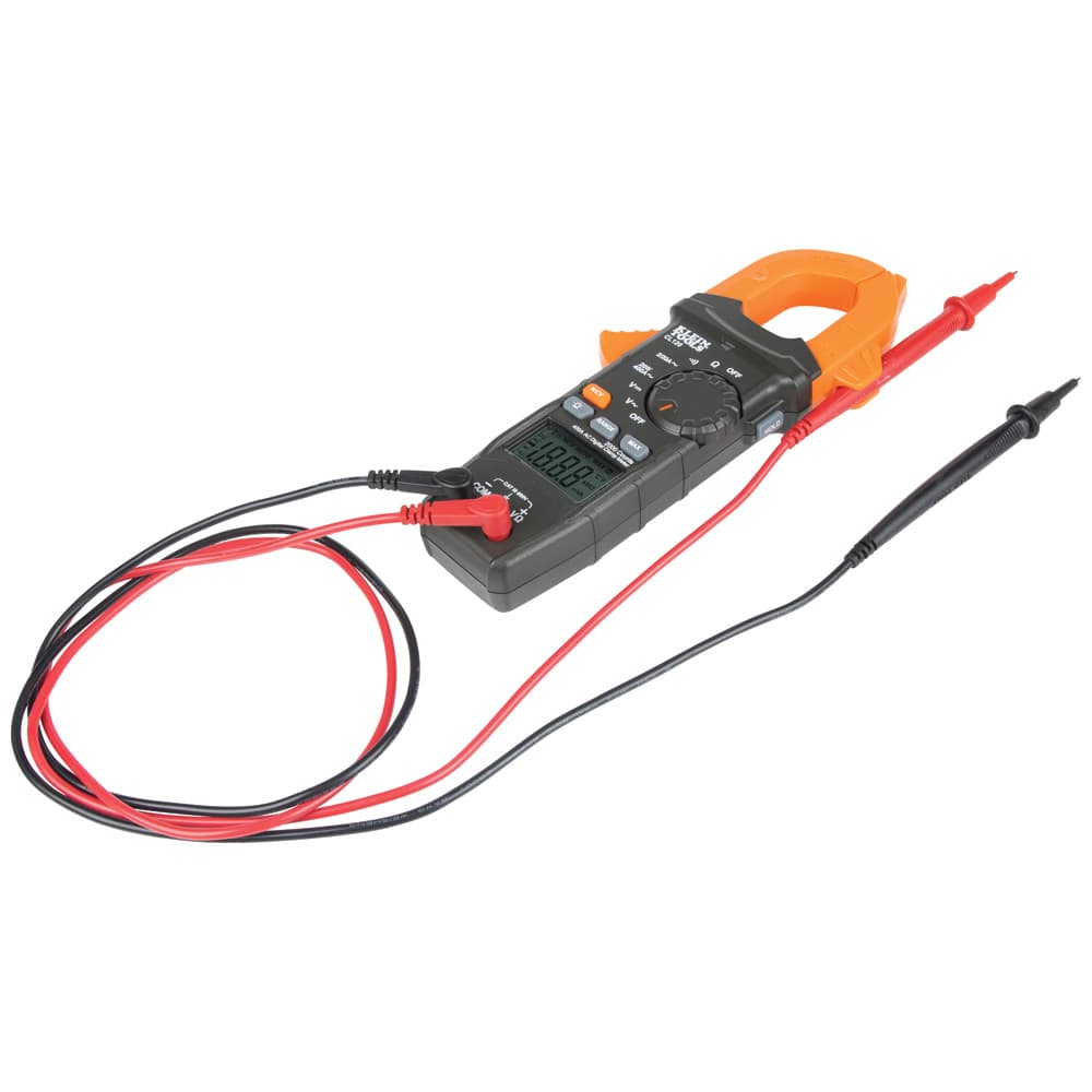 A perspective view of the Klein Tools CL120 digital clamp meter with its professional-grade red and black test leads plugged in. The large orange clamp jaw and backlit LCD display are positioned for easy use in electrical troubleshooting.