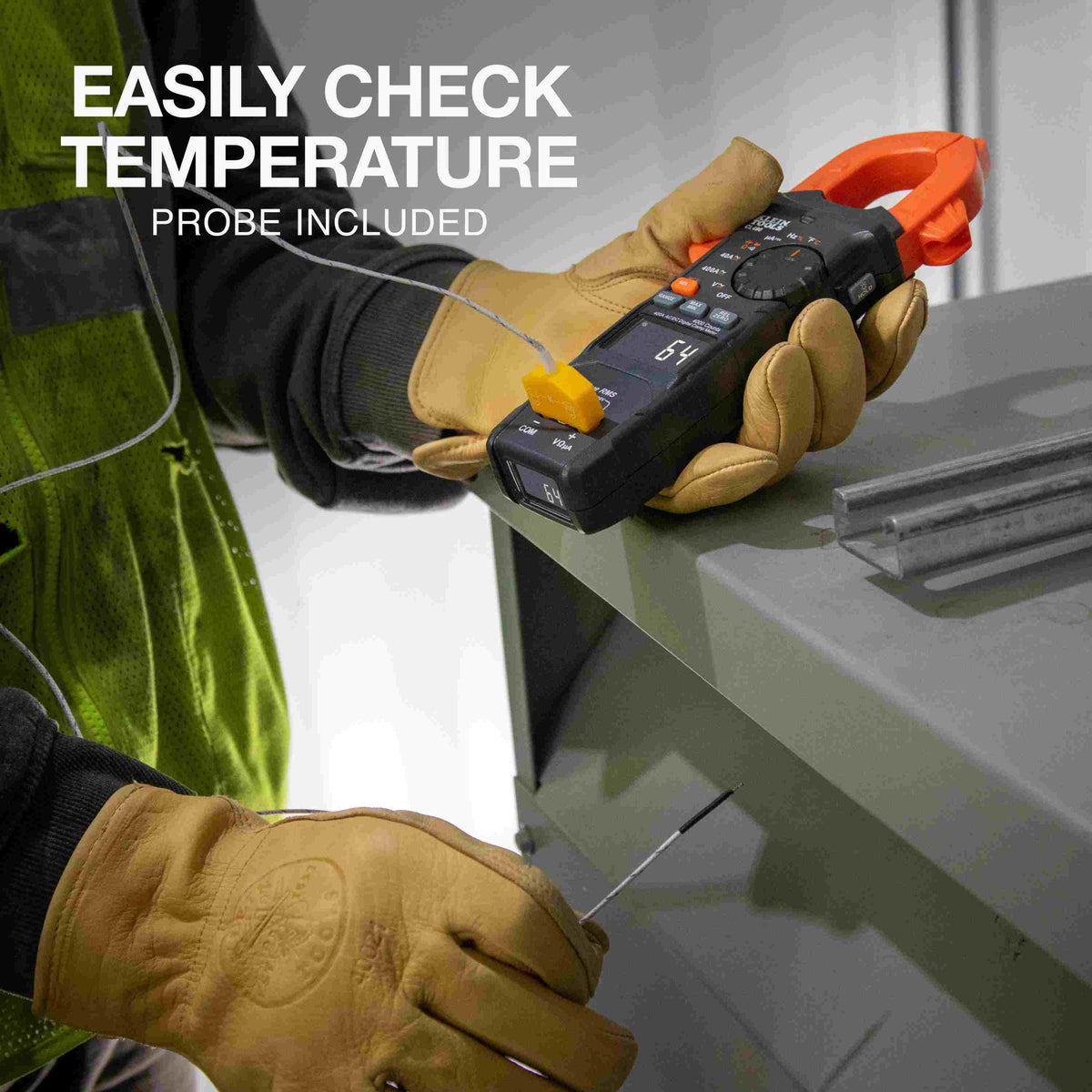 An HVAC technician using the meter with the included temperature probe to measure a metal duct, showing a reading of 64 degrees Fahrenheit on both screens.