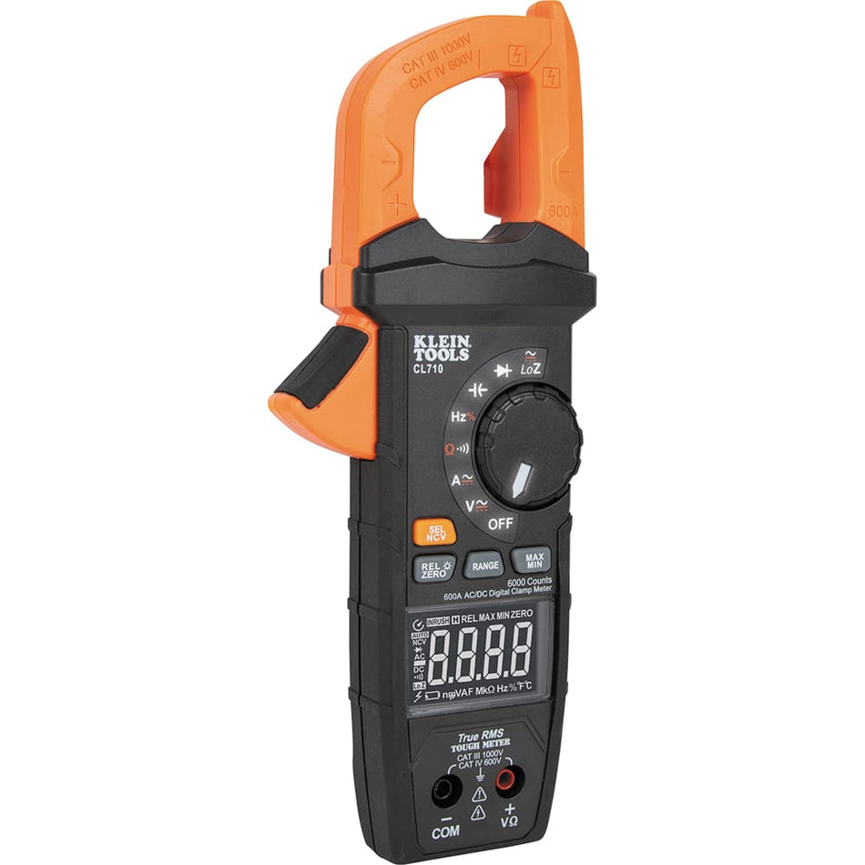 Front view of the Klein Tools CL710 600A AC/DC TRMS Digital Clamp Meter featuring a professional black and orange ruggedized housing. The image showcases the large clamp jaw, an illuminated selection dial for various electrical functions, and a high-visibility 6000-count digital display.