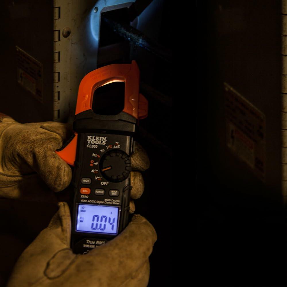 zQXbPpPVLGuLP4LorS1kj.jpeg
Person using Klein Tools CL800 clamp meter to measure AC current in an electrical panel, with display showing a reading of 0.04 amps.
