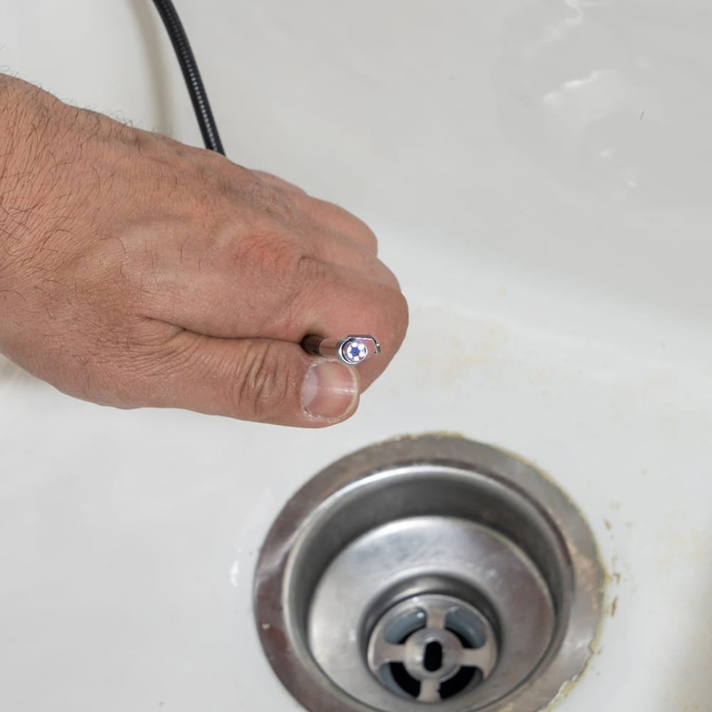 Close-up of the ET19 Pro 5.5mm dual-lens camera head with its 6 integrated LEDs fully illuminated. The bright light output is shown providing high-intensity illumination for the waterproof IP67 sensor, which is essential for viewing dark, confined spaces in plumbing and mechanical systems.